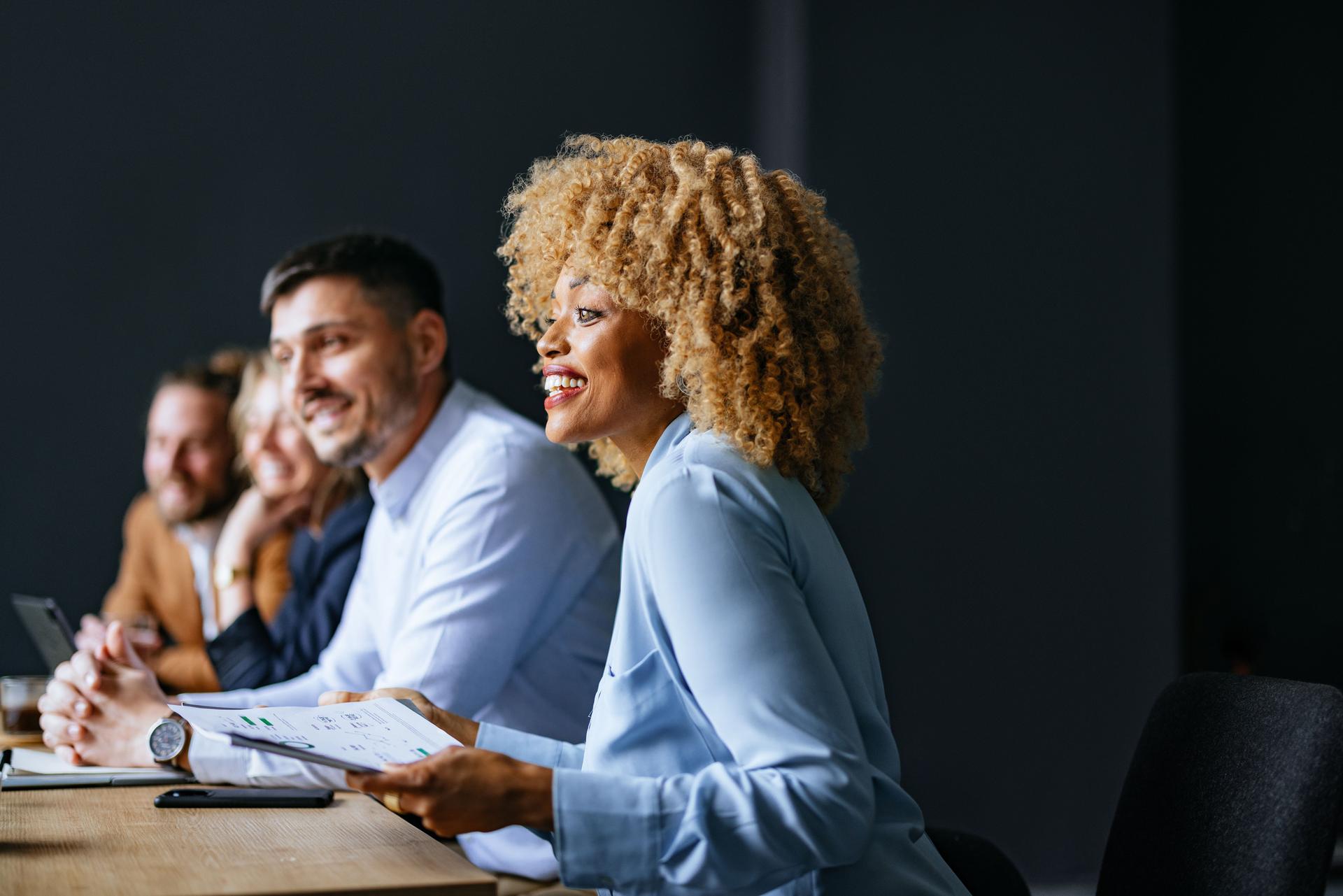Group Of Happy Businesspeople Working Together On A New Project At Their Company